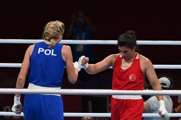 Turkey's Busenaz Surmeneli and Poland's Karolina Koszewska shake hands at the end of their women's welter preliminaries round of 16 boxing match...