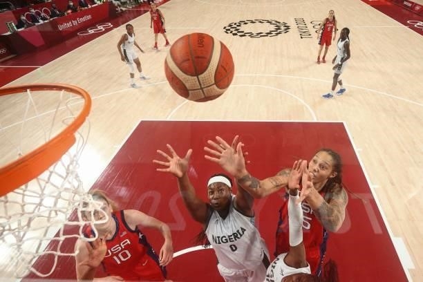 S Brittney Griner and Nigeria's Amy Okonkwo jump for a rebound in the women's preliminary round group B basketball match between Nigeria and USA...