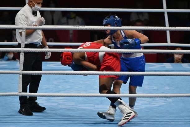 Britain's Caroline Dubois and Kosovo's Donjeta Sadiku fight during their women's light preliminaries boxing match during the Tokyo 2020 Olympic Games...