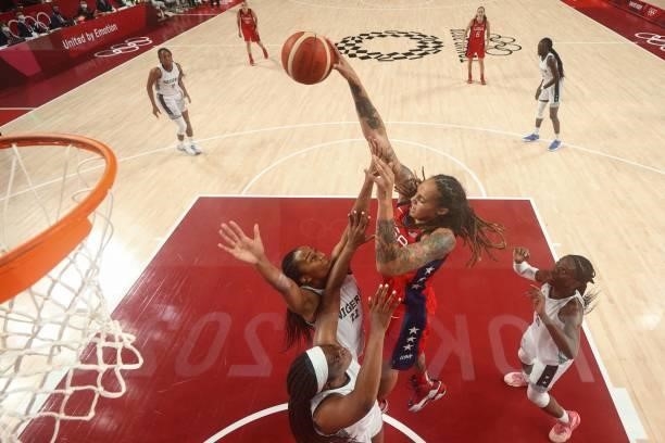 S Brittney Griner goes to the basket past Nigeria's Oderah Chidom in the women's preliminary round group B basketball match between Nigeria and USA...