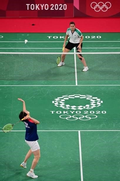 Hong Kong's Cheung Ngan Yi hits a shot to Israel's Ksenia Polikarpova in their women's singles badminton group stage match during the Tokyo 2020...