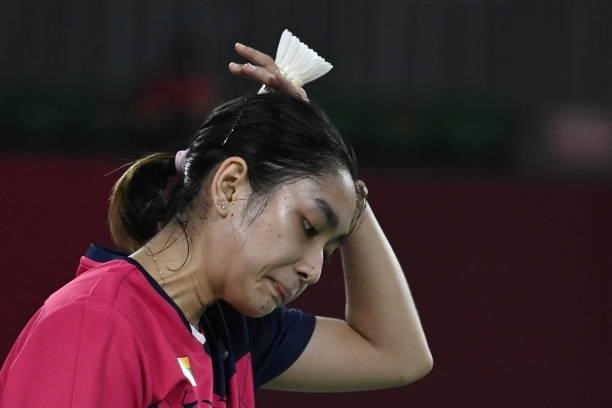 Myanmar's Thet Htar Thuzar reacts between points with Belgium's Lianne Tan in their women's singles badminton group stage match during the Tokyo 2020...