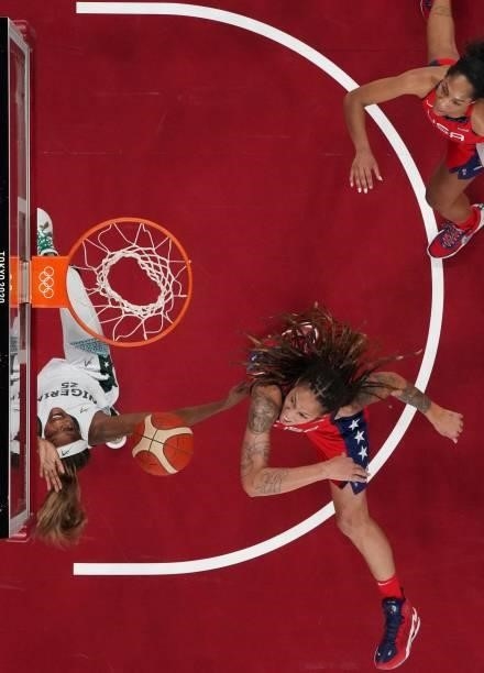 S Brittney Griner and Nigeria's Victoria Macaulay jump for a rebound in the women's preliminary round group B basketball match between Nigeria and...