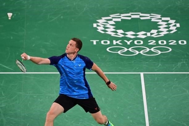 Ukraine's Artem Pochtarov hits a shot to France's Brice Leverdez in their men's singles badminton group stage match during the Tokyo 2020 Olympic...