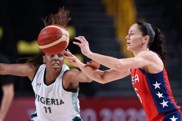S Sue Bird passes the ball past Nigeria's Adaora Elonu in the women's preliminary round group B basketball match between Nigeria and USA during the...
