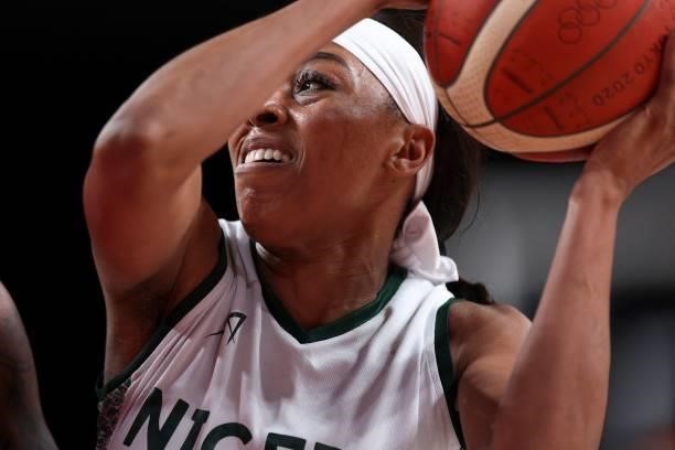 Nigeria's Atonye Nyingifa controls the ball in the women's preliminary round group B basketball match between Nigeria and USA during the Tokyo 2020...