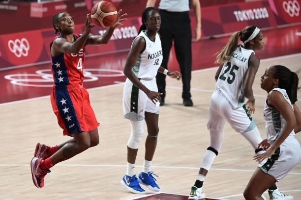 S Jewell Loyd shoots the ball as Nigeria's Ify Ibekwe and Victoria Macaulay watch in the women's preliminary round group B basketball match between...