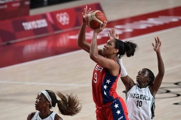 S A'ja Wilson shoots the ball as Nigeria's Promise Amukamara watches in the women's preliminary round group B basketball match between Nigeria and...