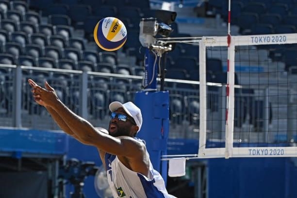 Brazil's Evandro Goncalves Oliveira Junior plays a shot during their men's preliminary beach volleyball pool E match between Brazil and Morocco...
