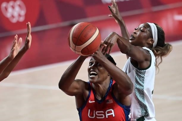 S Sylvia Fowles shoots the ball in the women's preliminary round group B basketball match between Nigeria and USA during the Tokyo 2020 Olympic Games...