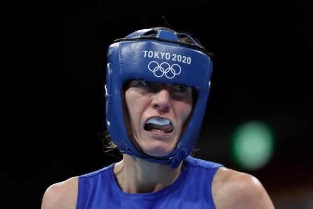 Poland's Karolina Koszewska reacts as she fights Turkey's Busenaz Surmeneli during their women's welter preliminaries round of 16 boxing match during...