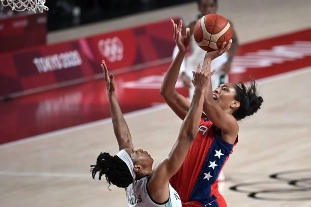 S A'ja Wilson shoots the ball as Nigeria's Pallas Kunaiyi-Akpanah tries to block in the women's preliminary round group B basketball match between...