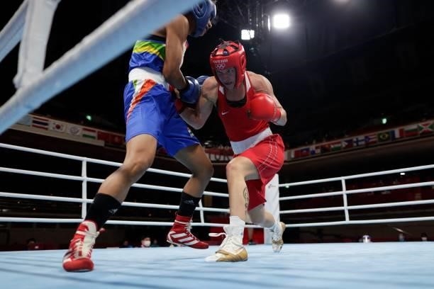 Germany's Nadine Apetz and India's Lovlina Borgohain fight during their women's welter preliminaries round of 16 boxing match during the Tokyo 2020...