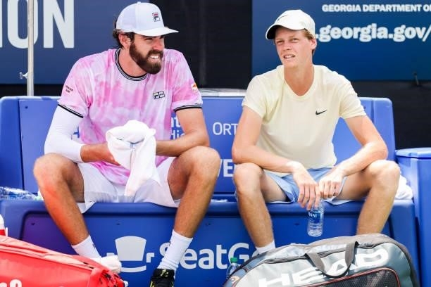 Reilly Opelka of the United States and Jannik Sinner of Italy are seen after winning a doubles match against Jonathan Erlich of Israel and Santiago...