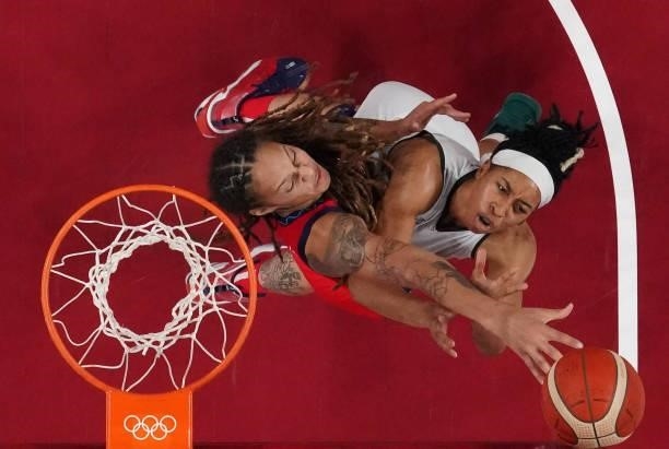 S Brittney Griner fights for a rebound with Nigeria's Pallas Kunaiyi-Akpanah in the women's preliminary round group B basketball match between...