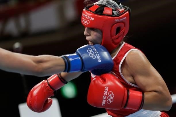 Morocco's Oumayma Bel Ahbib and Ukraine's Anna Lysenko fight during their women's welter preliminaries round of 16 boxing match during the Tokyo 2020...