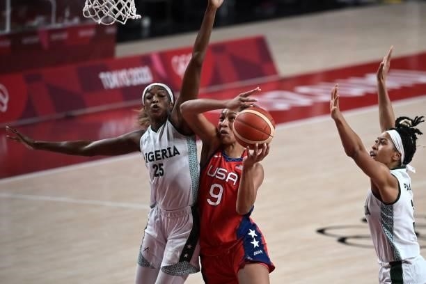 S A'ja Wilson goes to the basket as Nigeria's Victoria Macaulay tries to block in the women's preliminary round group B basketball match between...