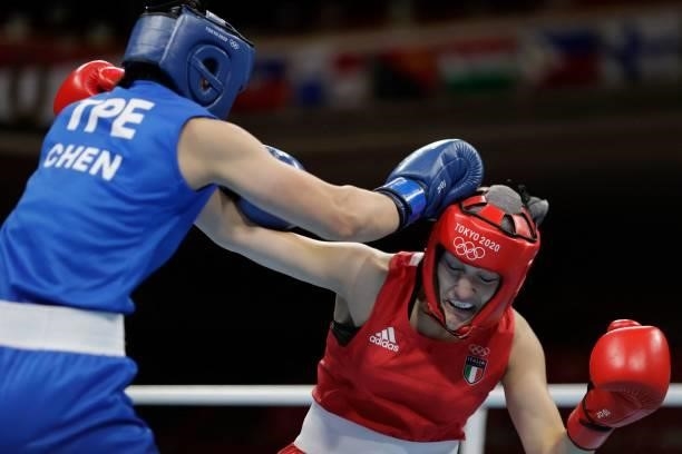 Italy's Angela Carini and Chinese Taipei's Nien-Chin Chen fight during their women's welter preliminaries round of 16 boxing match during the Tokyo...