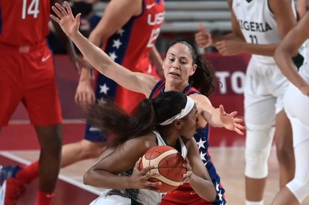 S Sue Bird tries to block Nigeria's Atonye Nyingifa in the women's preliminary round group B basketball match between Nigeria and USA during the...