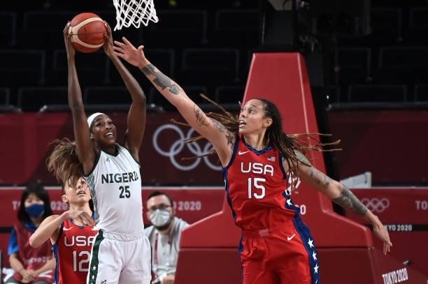 S Brittney Griner fights for the ball with Nigeria's Victoria Macaulay in the women's preliminary round group B basketball match between Nigeria and...