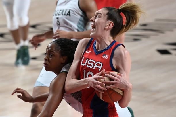 S Breanna Stewart reacts while handling the ball in the women's preliminary round group B basketball match between Nigeria and USA during the Tokyo...