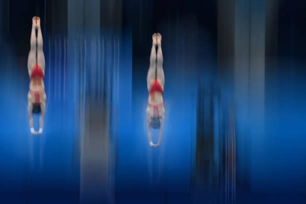 China's Zhang Jiaqi and China's Chen Yuxi compete in the women's synchronised 10m platform diving final event during the Tokyo 2020 Olympic Games at...