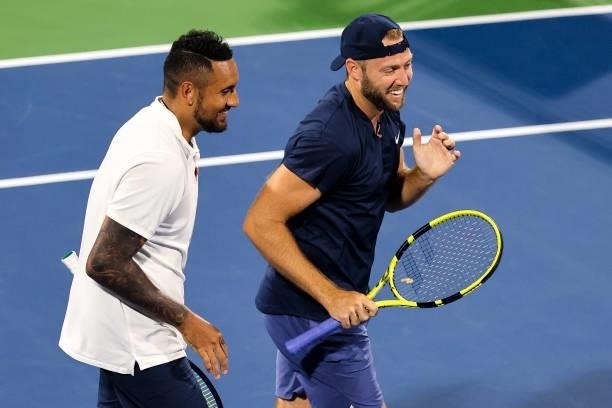Jack Sock of the United States laughs with Nick Kyrgios of Australia during a doubles match against Aisam-Ul-Haq Qureshi of Pakistan and Divij Sharan...