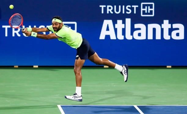 Divij Sharan of India returns a shot during a doubles match with Aisam-Ul-Haq Qureshi of Pakistan against Nick Kyrgios of Australia and Jack Sock of...