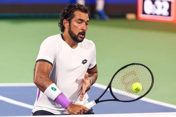Aisam-Ul-Haq Qureshi of Pakistan returns a shot during a doubles match with Divij Sharan of India against Nick Kyrgios of Australia and Jack Sock of...