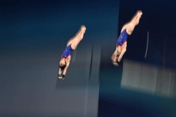 Japan's Minami Itahashi and Japan's Matsuri Arai compete in the women's synchronised 10m platform diving final event during the Tokyo 2020 Olympic...