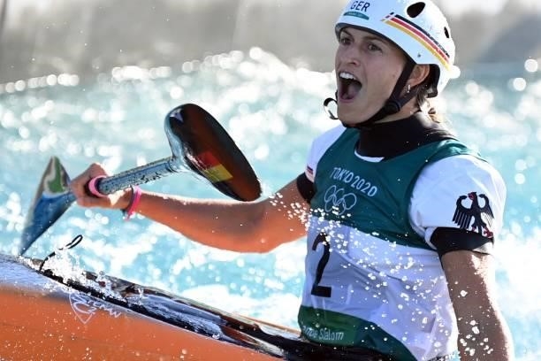Germany's Ricarda Funk celebrates in the finish area of the women's Kayak final during the Tokyo 2020 Olympic Games at Kasai Canoe Slalom Centre in...
