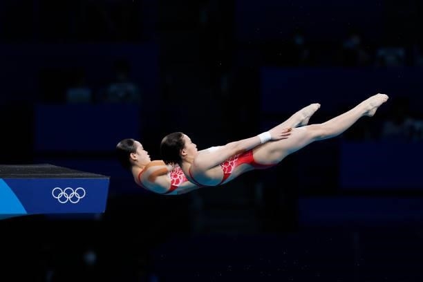 Yuxi Chen and Jiaqi Zhang of Team China compete during the Women's Synchronised 10m Platform Final on day four of the Tokyo 2020 Olympic Games at...