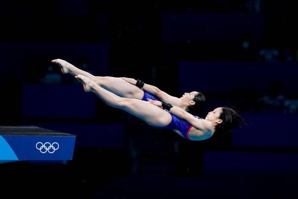 Minami Itahashi and Matsuri Arai of Team Japan compete during the Women's Synchronised 10m Platform Final on day four of the Tokyo 2020 Olympic Games...