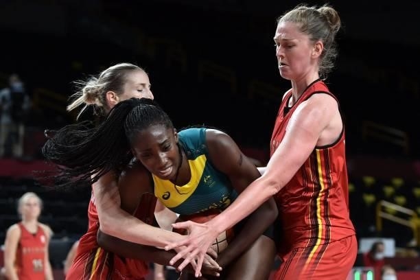 Australia's Ezi Magbegor fights for the ball with Belgium's players in the women's preliminary round group C basketball match between Australia and...