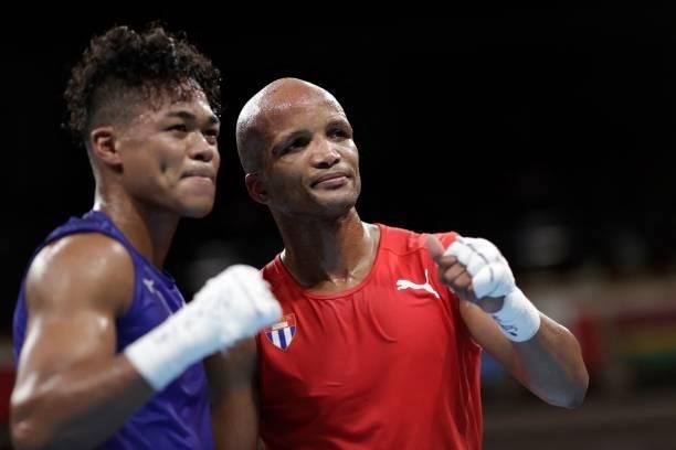 Cuba's Roniel Iglesias and Japan's Sewonrets Quincy Mensah Okazawa pose at the end of their men's welter preliminaries round of 16 boxing match...
