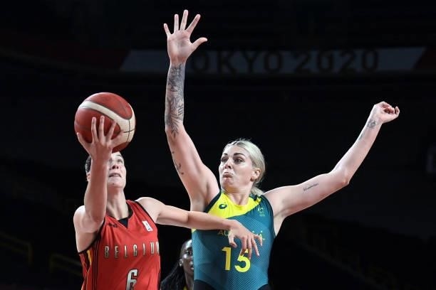 Belgium's Antonia Delaere goes to the basket as Australia's Cayla George tries to block in the women's preliminary round group C basketball match...