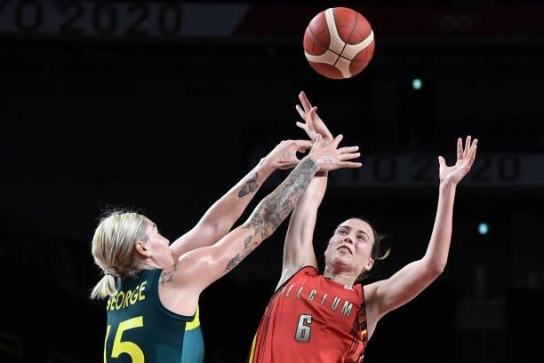 Australia's Cayla George and Belgium's Antonia Delaere jump for the ball in the women's preliminary round group C basketball match between Australia...