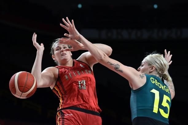 Belgium's Kyara Linskens and Australia's Cayla George fight for the ball in the women's preliminary round group C basketball match between Australia...