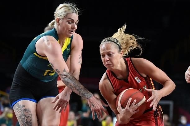 Australia's Cayla George fights for the ball with Belgium's Julie Allemand in the women's preliminary round group C basketball match between...