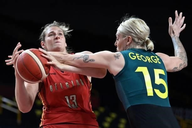 Belgium's Kyara Linskens and Australia's Cayla George fight for the ball in the women's preliminary round group C basketball match between Australia...