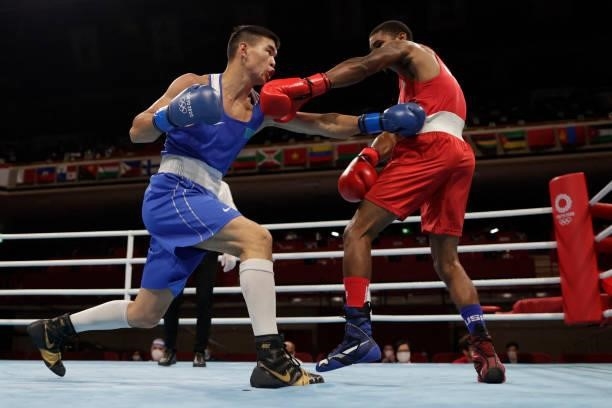 S Delante Marquis Johnson and Kazakhstan's Ablaikhan Zhussupov fight during their men's welter preliminaries round of 16 boxing match during the...