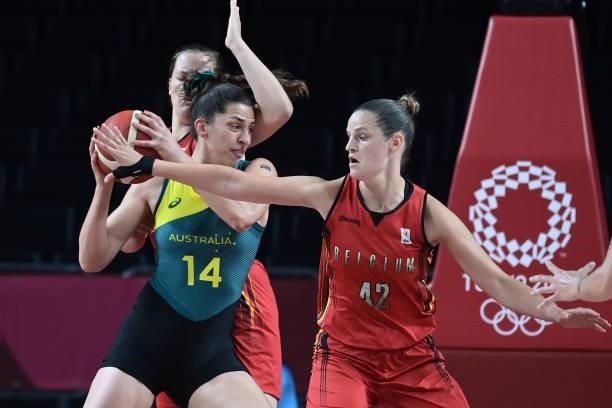 Belgium's Jana Raman fights for the ball with Australia's Marianna Tolo in the women's preliminary round group C basketball match between Australia...