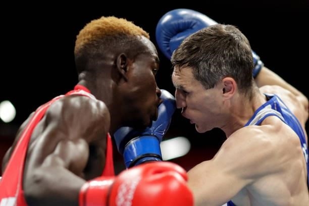 Zambia's Steven Zimba and Russia's Andrei Zamkovoi fight during their men's welter preliminaries round of 16 boxing match during the Tokyo 2020...
