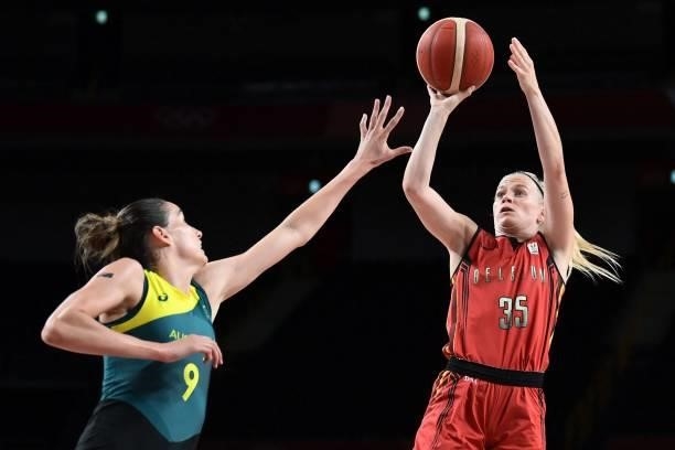 Belgium's Julie Vanloo shoots the ball as Australia's Bec Allen tries to block in the women's preliminary round group C basketball match between...