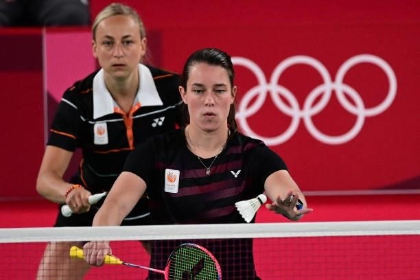 Netherlands' Cheryl Seinen serves next to Netherlands' Selena Piek in their women's doubles badminton group stage match against Japan's Wakana...