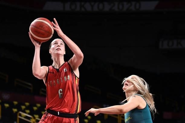 Belgium's Antonia Delaere goes to the basket as Australia's Tess Madgen reacts in the women's preliminary round group C basketball match between...