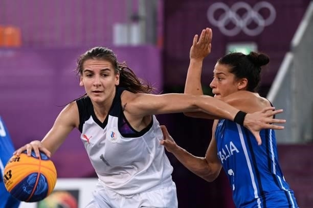 Russia's Yulia Kozik fights for the ball with Italy's Raelin D Alie during the women's pool round 3x3 basketball match between Russia and Italy at...