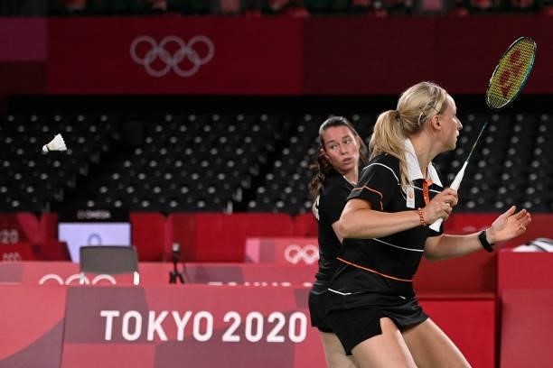 Netherlands' Cheryl Seinen watches the shuttlecock next to Netherlands' Selena Piek in their women's doubles badminton group stage match against...