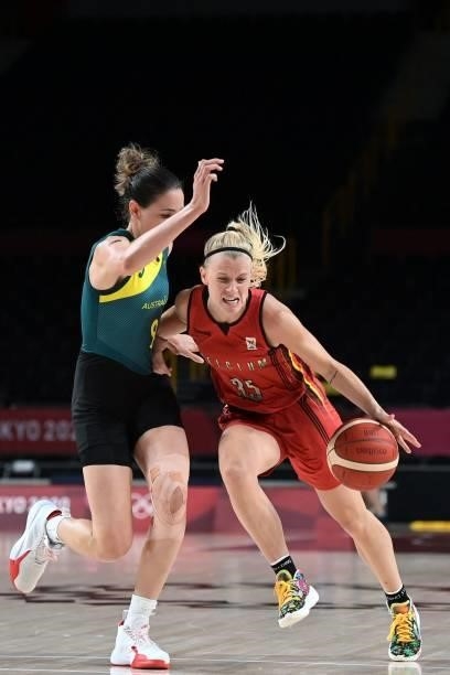 Belgium's Julie Vanloo dribbles the ball past Australia's Bec Allen in the women's preliminary round group C basketball match between Australia and...