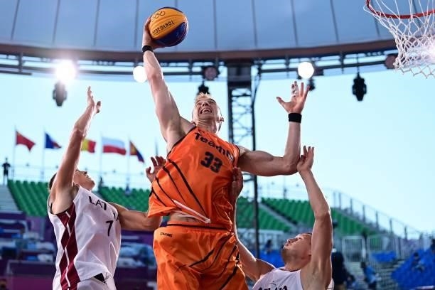 Netherlands' Ross Bekkering jumps to score during the men's first round 3x3 basketball match between Latvia and Netherlands at the Aomi Urban Sports...